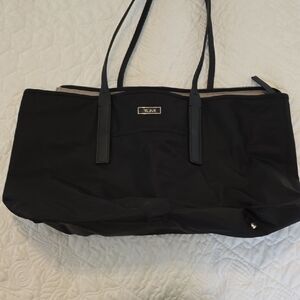 Sleek Tumi Black Tote Bag with Minimalist Design and Spacious Interior